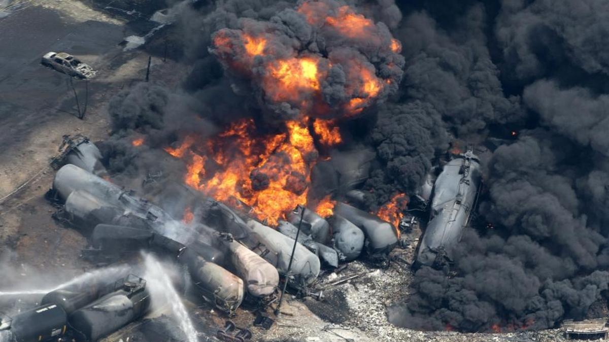 Smoke rises from railway cars carrying crude oil that derailed in downtown Lac-Megantic, Quebec, on July 6, 2013. A large swath of the town was destroyed and 47 people killed in what became the worst oil train derailment in North America.