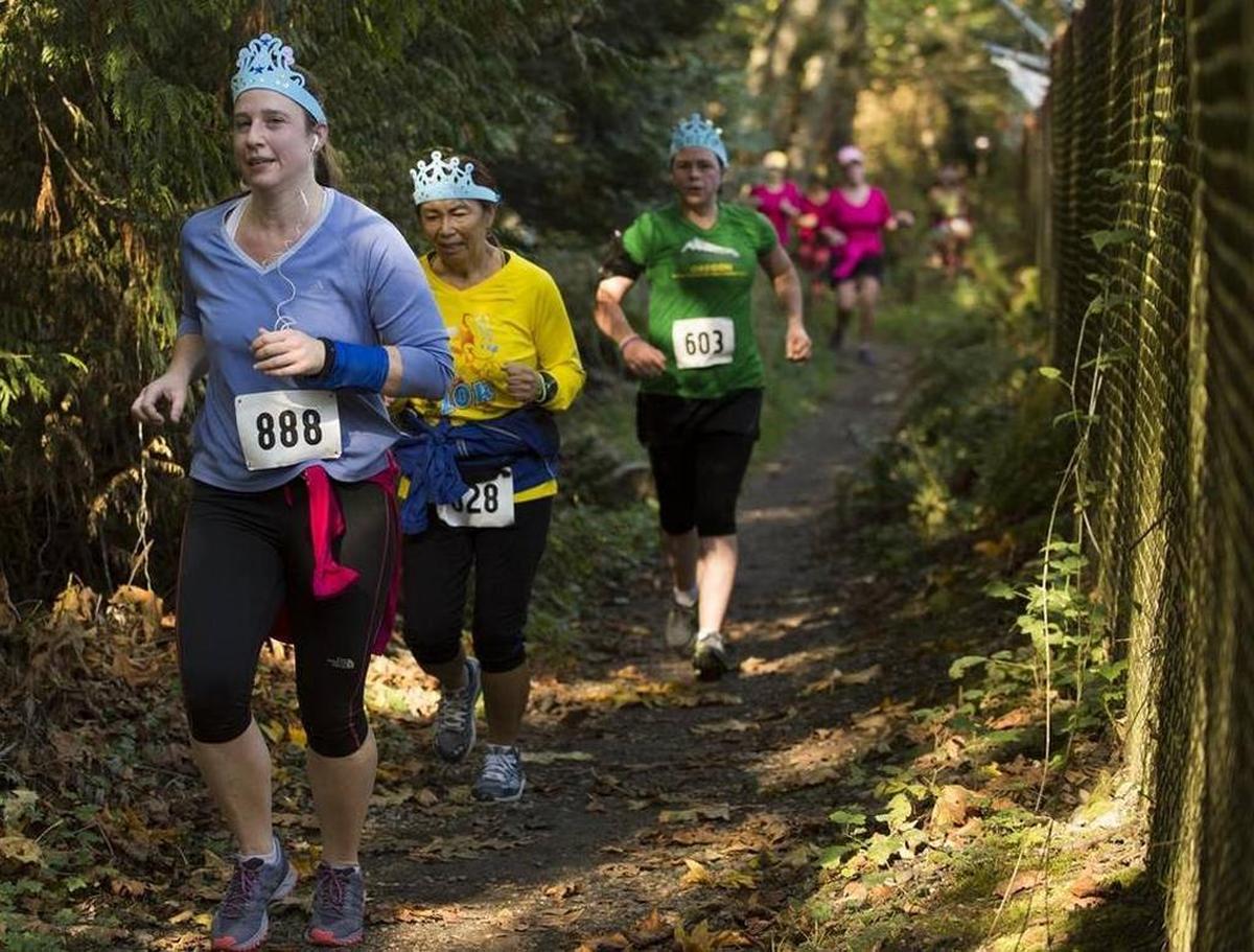 Runners make their way along the route for the Run Like a Girl half marathon Saturday, Oct. 3, in Bellingham. Costumes and bright colors were the norm.
