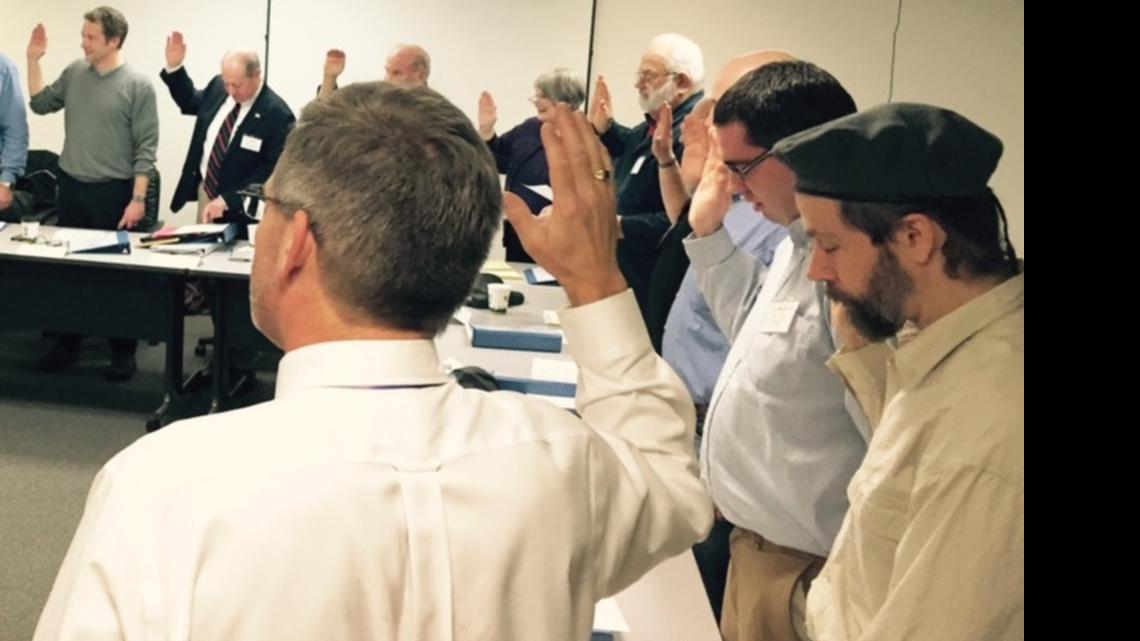 
Richard May, right, is sworn into office with the rest of the Whatcom
County Charter Review Commission on Jan. 12, 2015, in Bellingham.
