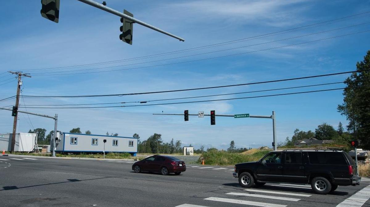 Vehicles travel through the future intersection of West Bakerview Road and Arctic Avenue on Wednesday, June 22, in Bellingham. Costco is still negotiating with a property owner to create a right-turn lane on westbound Bakerview onto Arctic.