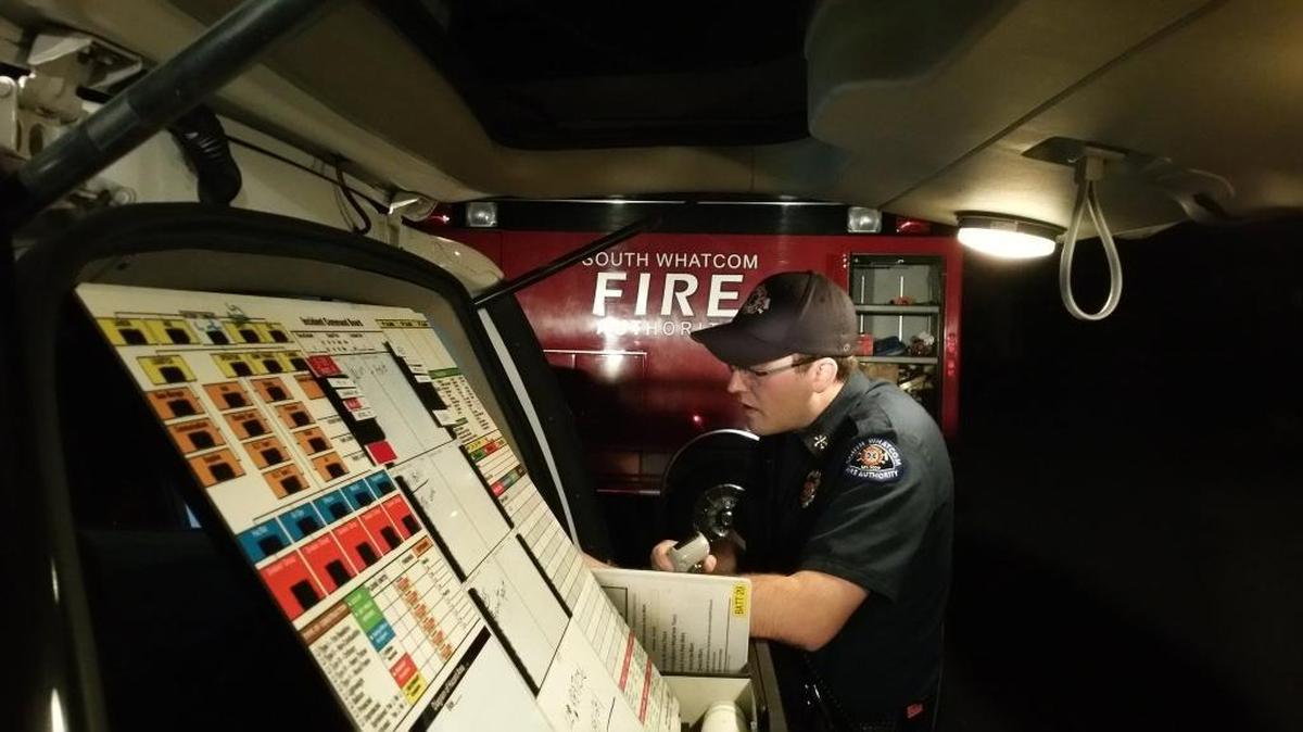 Mitch Nolze, a battalion chief of the South Whatcom Fire Authority, coordinates the rescue of an injured hiker who fell 40 feet into the water Saturday evening, March 5, at Larrabee State Park.