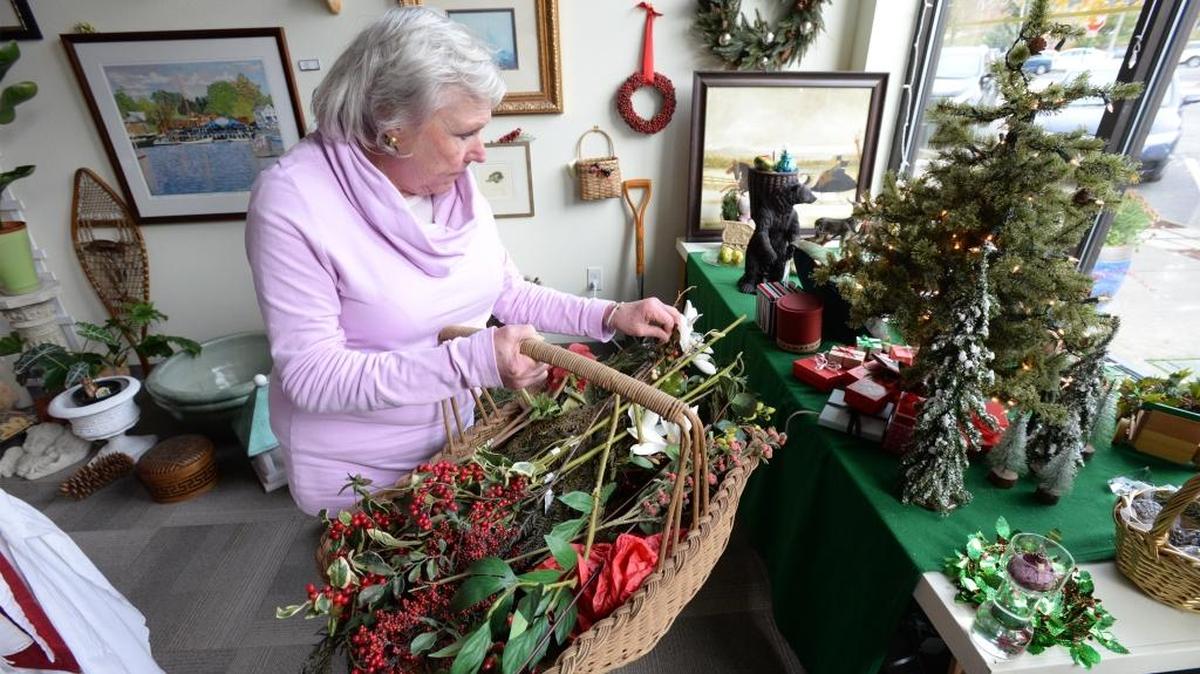 The Oyster, Home & Garden Decor owner Barbara Cronin sets up holiday decorations in her Fairhaven store in Bellingham, Thursday, Nov. 16, 2017. Many businesses throughout Whatcom County also will be participating in Small Business Saturday