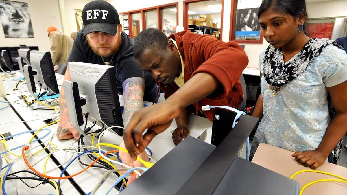 Whatcom Community College students participate in a cybersecurity lab assignment in June 2011. The college is offering free cybersecurity camps for middle and high school students in summer 2016.