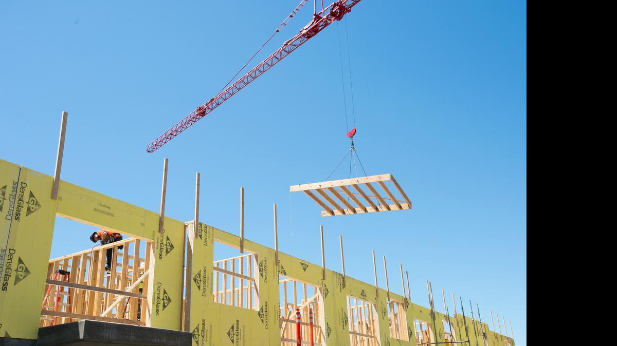 
Dawson Construction employees work on a new apartment building near Depot Market Square on Tuesday, June 30, in Bellingham, Washington. Whatcom County ranked second in the nation for growth in construction jobs in May.
