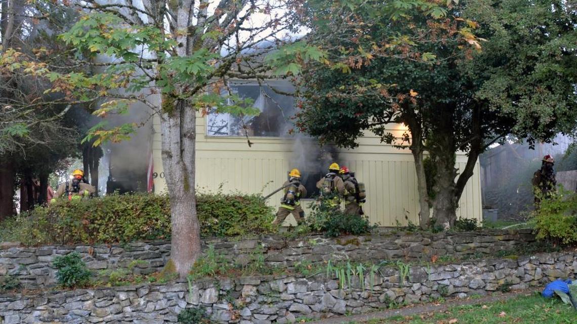 Bellingham firefighters battle smoke and flames at a duplex fire Wednesday, Oct. 5, at 908 Key St. No one was seriously hurt.
