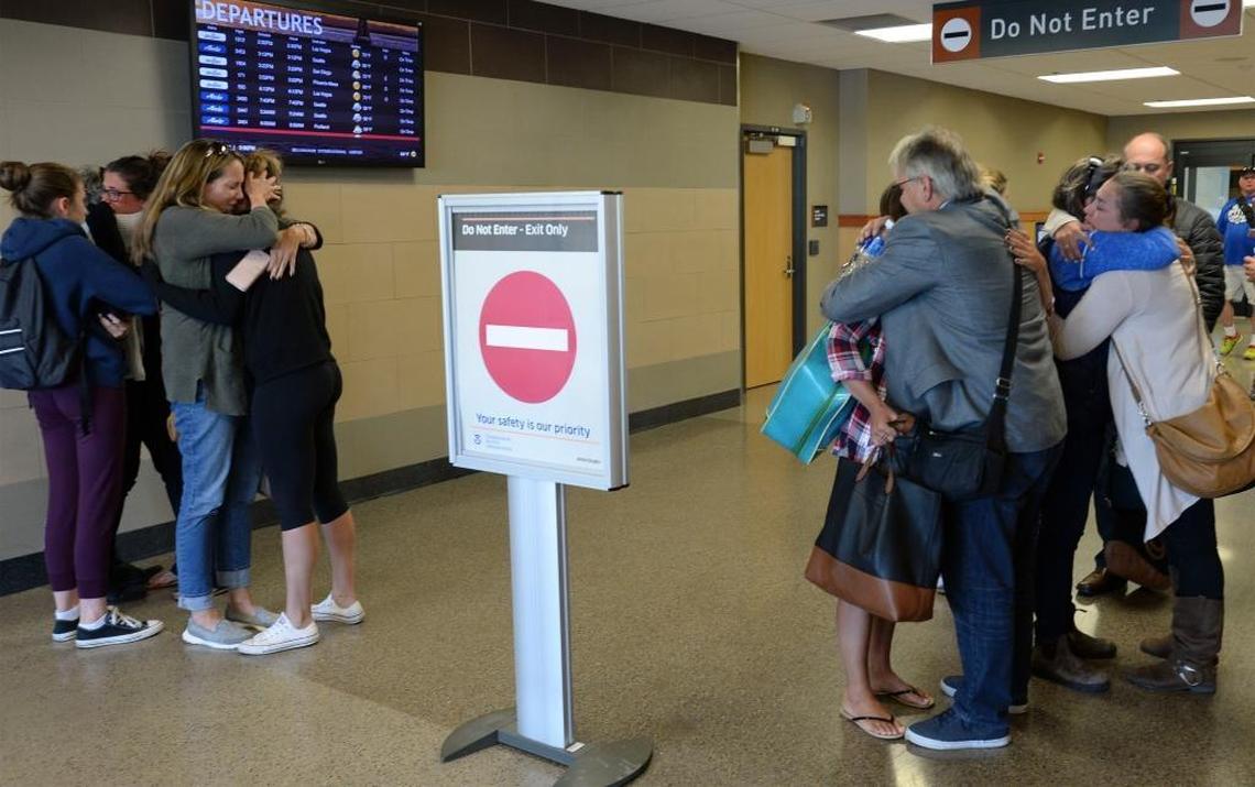 Family members greet survivors of the Las Vegas concert shooting after they arrived at the Bellingham International Airport Monday, Oct. 2, 2017.
