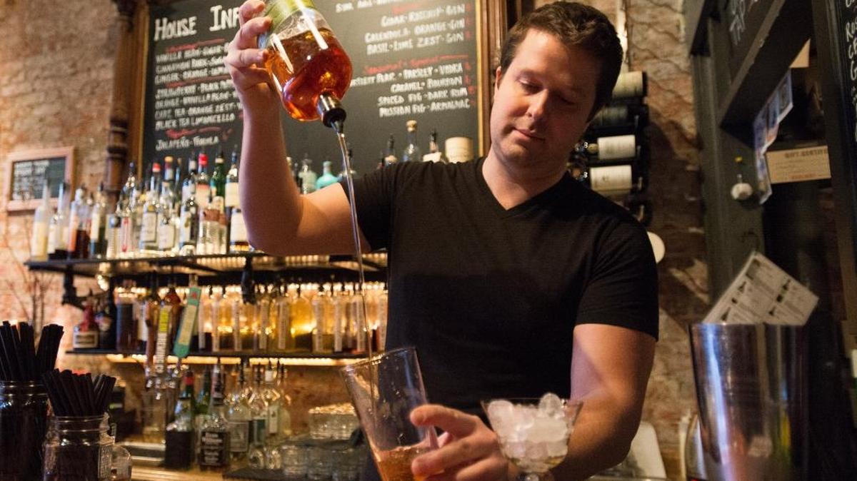 Andrew Schutte demonstrates making a spiced pear Sazerac at Redlight on Wednesday, Nov. 25, in downtown Bellingham. Redlight is one of 10 places participating in the inaugural Bellingham Cocktail Week beginning Monday, Nov. 30.