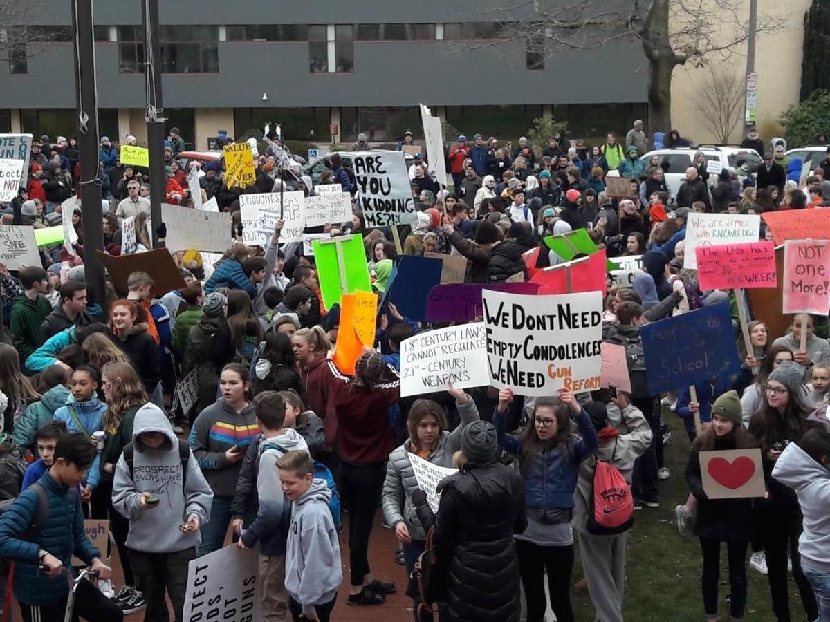Students from across Bellingham gather in front of City Hall on Wednesday, Feb. 21, 2018, to protest gun violence and promote school safety.