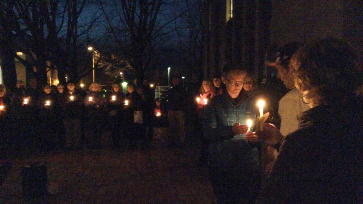Around 200 people gathered outside Bellingham City Hall for a candlelight memorial the night of Dec. 21, 2015, to remember those who had experienced homelessness and died in 2014 and 2015.