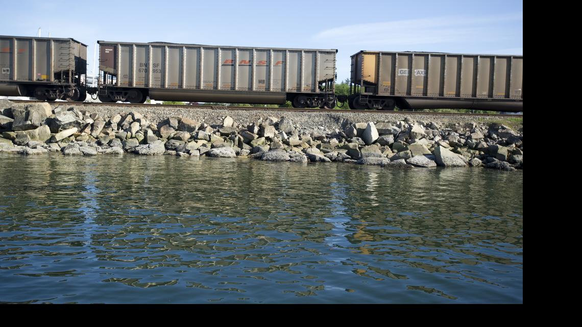 
A coal train rolls through Fairhaven next to the Community Boating Center, April 30, 2014 in Bellingham. A new study suggests additional coal trains would have detrimental impacts to business and tourism, especially along Bellingham’s waterfront.
