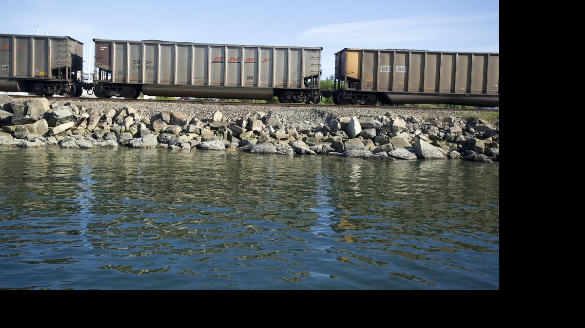 
A coal train rolls through Fairhaven next to the Community Boating Center, April 30, 2014 in Bellingham. A new study suggests additional coal trains would have detrimental impacts to business and tourism, especially along Bellingham’s waterfront.

