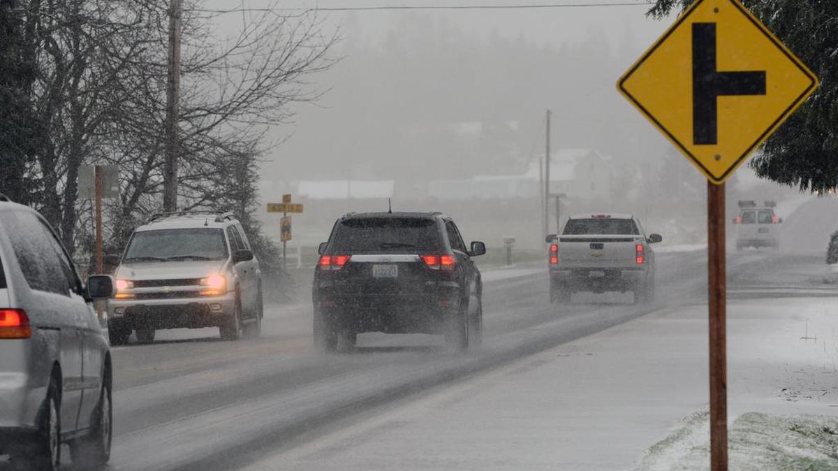 Drivers are shown on Hannegan Road near Wiser Lake amid snow flurries in December 2015. Flurries are possible Wednesday night and Thursday in the Whatcom County lowlands down to around 500 feet.