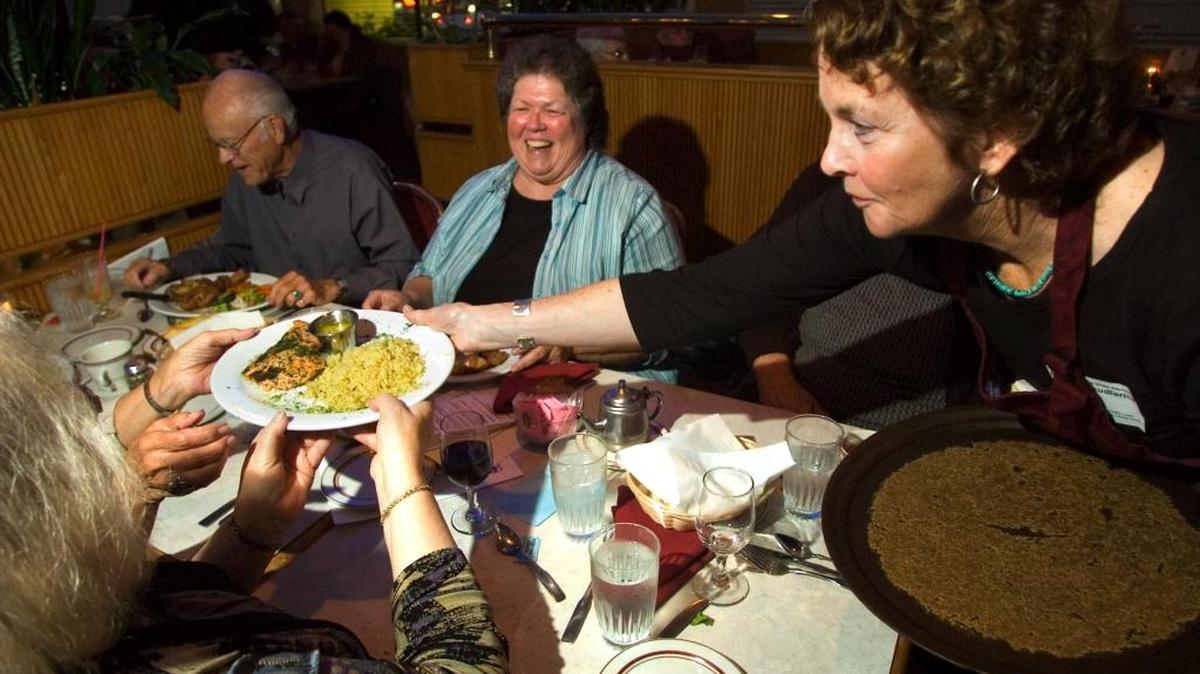
Barbara Skudlarick serves dinner during the annual Support Officer Community Care Fundraiser Dinner at the Five Columns Restaurant in Bellingham in 2008. This year police and firefighters will serve dinner for the fundraiser on Monday, Oct. 12.
