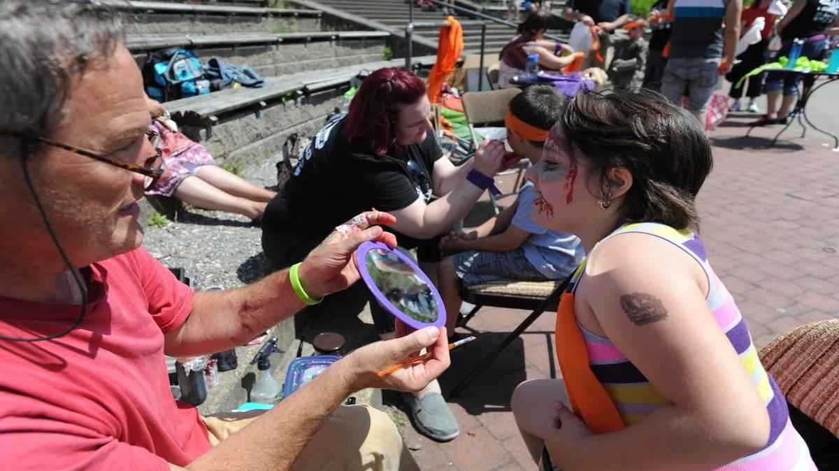 A “zombie” gets made up before the 2014 edition of Save Our City: Zombies vs. Survivors. The 2016 event begins at noon Saturday, May 21, at Maritime Heritage Park in Bellingham.