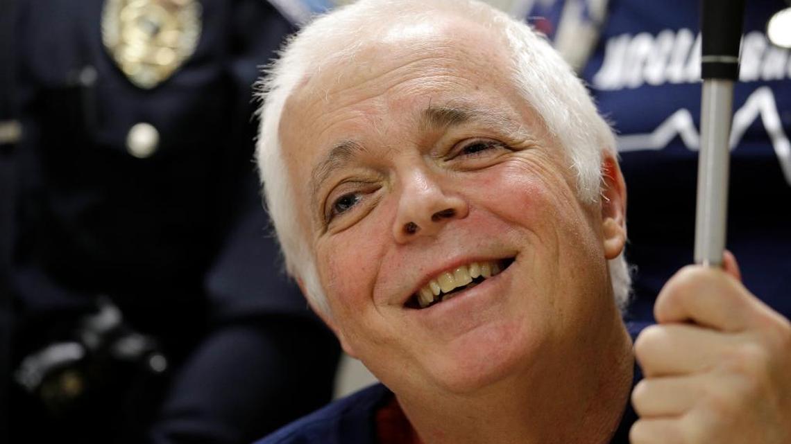 Mount Vernon police officer Michael McClaughry smiles during a news conference shortly before his discharge Tuesday, Feb. 14, 2017, at Harborview Medical Center in Seattle. McClaughry was blinded when shot while on duty nearly two months earlier and was discharged from the hospital on Valentine’s Day, also his 39th wedding anniversary.