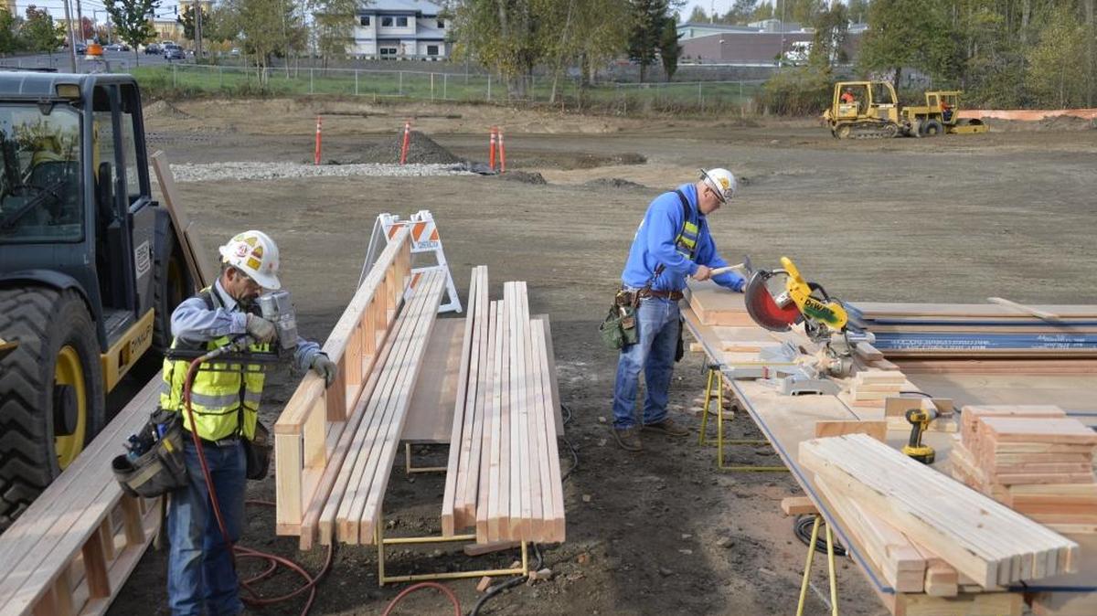 Workers build cement forms for a retention pond at a construction site on West Bakerview Road east of Northwest Drive in Bellingham in this file photo. Construction work continues to be a main driver in the local economy’s job growth.