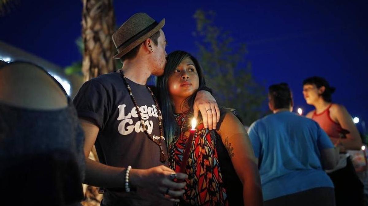 Two people embrace during a vigil at The Center, a community center for the LGBT community, Sunday, June 12, 2016, in Las Vegas. The vigil was for the victims of the Pulse nightclub shooting in Orlando. A Bellingham vigil is set for 9 p.m. Monday, June 13, outside Rumors, 1119 Railroad Ave.