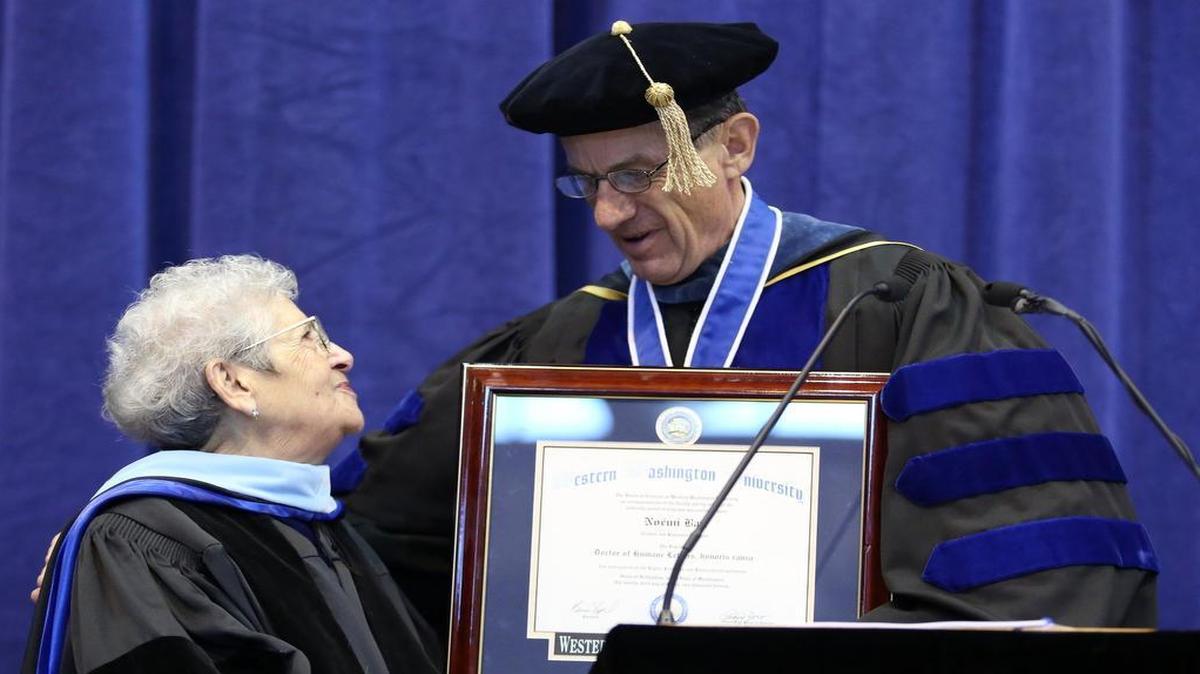 
Western Washington University president, Bruce Shepard, presents Holocaust survivor, Noemi Ban, with an honorary doctorate of Humane Letters during the graduation ceremony for Western's winter 2013 class March 23, 2013, in Bellingham.
