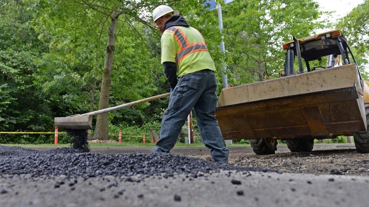 Colacurcio Brothers Construction worker Mike Snow works on Bill McDonald Parkway on the Western Washington University campus Tuesday morning, June 21, 2016. The repaving is one of many road construction projects drivers will encounter in Whatcom County this summer.