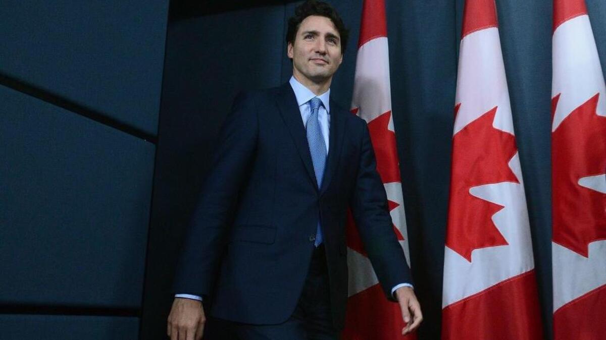 Prime Minister Justin Trudeau arrives to hold a press conference at the National Press Theatre in Ottawa, Ontario, on Tuesday, Nov. 29, 2016. Trudeau has approved one controversial pipeline from the Alberta oil sands to the Pacific Coast, but rejected another. On Tuesday, he approved Kinder Morgan’s Trans Mountain pipeline to Burnaby, British Columbia, but rejected Enbridge’s Northern Gateway pipeline to Kitimat, B.C.