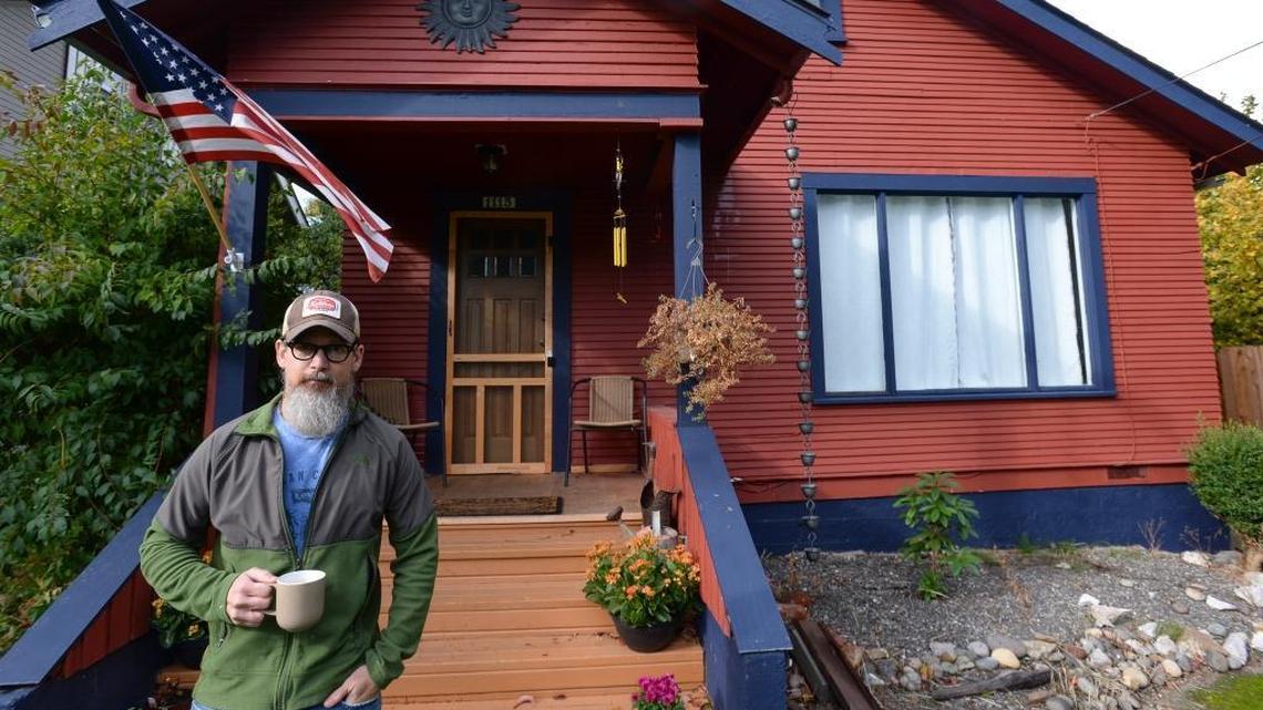 Owner Chris Robinson of Bellingham in front of his Airbnb on Friday, Oct. 20, 2017. Robinson bought the former two-bedroom college student rental and fixed it up. He said it is rented constantly.