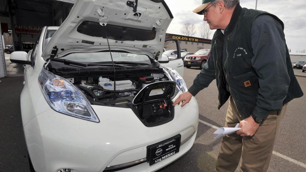 
Todd Shaner of Orcas Power & Light Cooperative checks out the first all-electric Nissan Leaf sold in Whatcom County on March 24, 2011. The North Sound Electric Vehicle Association is hosting its first car show on Sunday, Sept. 13, 2015.
