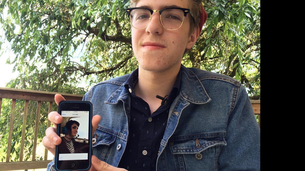 
Newton Goss, 16, displays a photo of his girlfriend, Autumn Veatch, 16, on his phone that was taken Saturday, the day she left on a flight with her step-grandparents that crashed, leaving her as the only survivor. Searchers recovered two bodies from wreckage of a plane believed to belong to her step-grandparents in Washington state.
