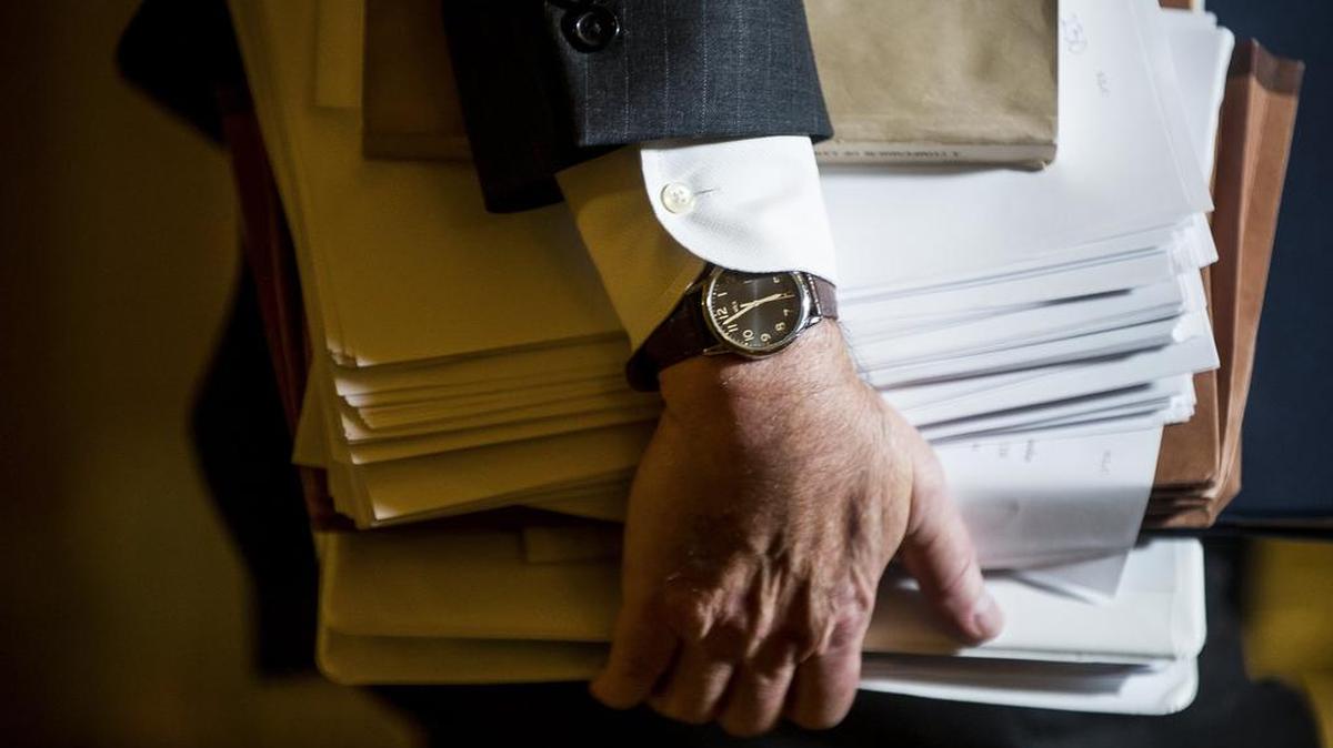 Multiple binders are carried on Capitol Hill on the evening Republicans advanced their tax legislation, in Washington, D.C., Dec. 1, 2017.