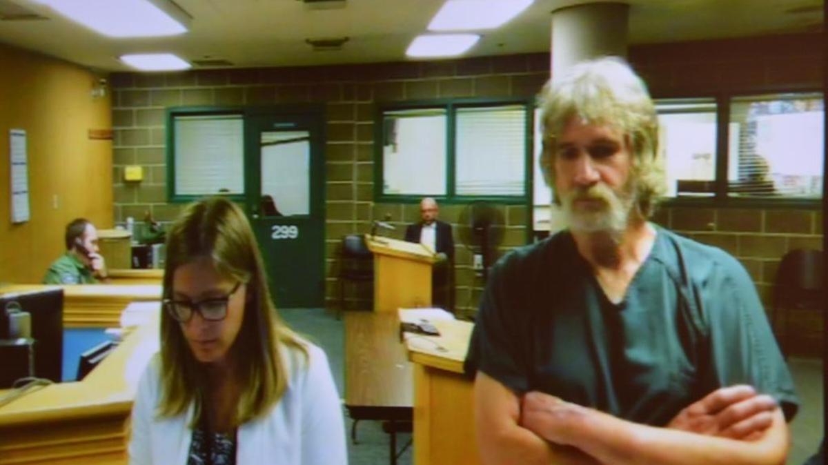 Kurt Ebe, 60, right, makes his first appearance in court Monday, July 18, alongside Deputy Public Defender Maialisa Vanyo. He’s accused of dousing a woman and her tent in gas, then lighting a match. She wasn’t hurt.