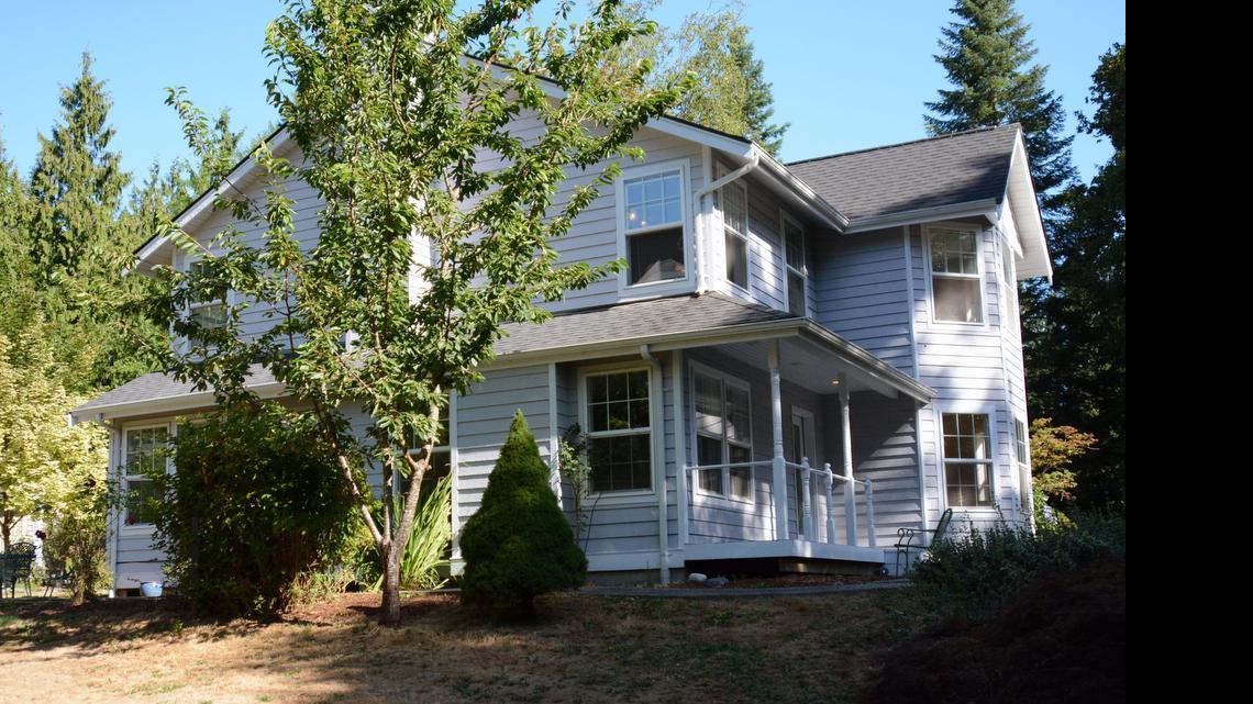 A teacher at Lummi Nation School and his 17-month-old son were found dead and a woman was found shot in the chest Sunday, July 19 at this home in the 5000 block of Noon Road.