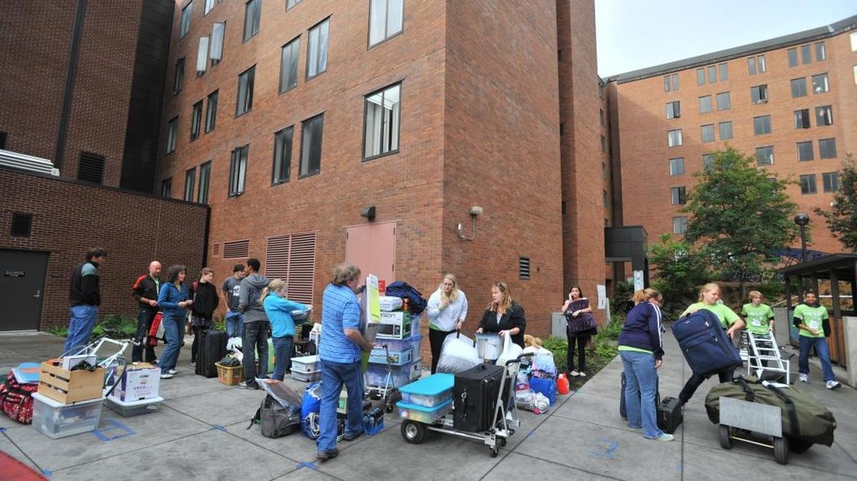 Incoming freshmen and their parents gather outside before moving into Buchanan Towers at Western Washington University on Sept. 17, 2011, in Bellingham. A woman reported being robbed near Buchanan Towers on Sunday night, April 10, 2016.