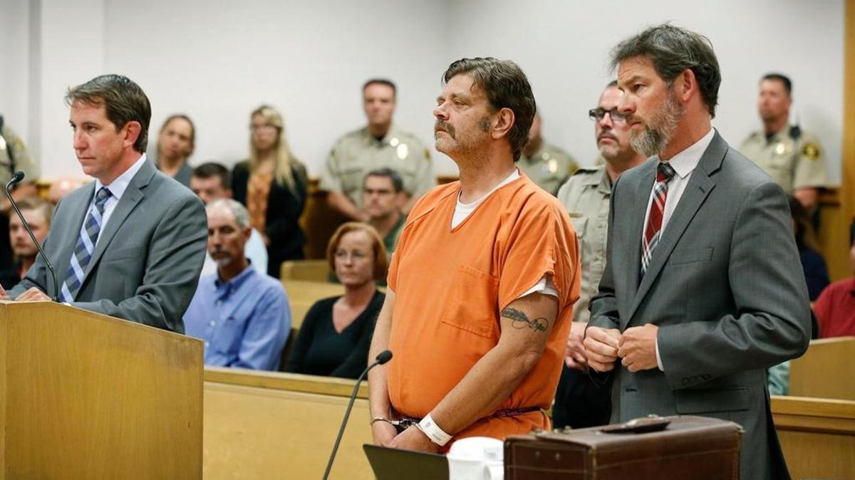 Mark Redwine makes his first appearance in district court Tuesday, Aug. 15, 2017, in Durango, Colo. He faces second-degree murder charges in connection with his son Dylan's death. With Redwine is one of his public defenders, Justin Bogan and at far left is District Attorney Christian Champagne.