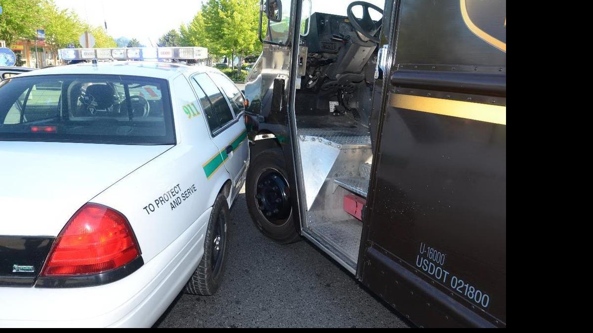 
A Whatcom County sheriff’s deputy, Colin Bertrand, stopped a runaway UPS truck with his patrol car Tuesday, June 30, 2015, on Coho Way in Bellingham. The delivery truck driver, 61, suffered a stroke.
