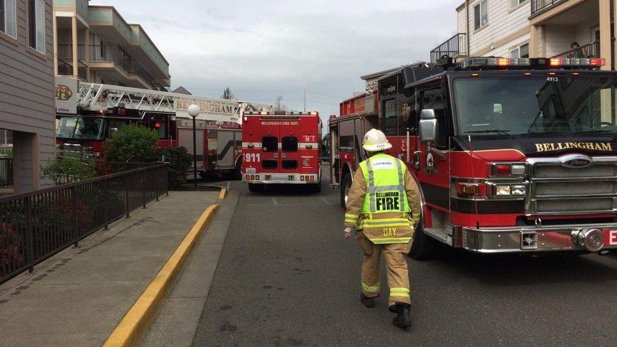 Bellingham firefighters respond to a grease fire that left a young woman with burns to her feet Wednesday morning, April 6, 2016, at Belleau Woods apartments, 4020 Northwest Ave.