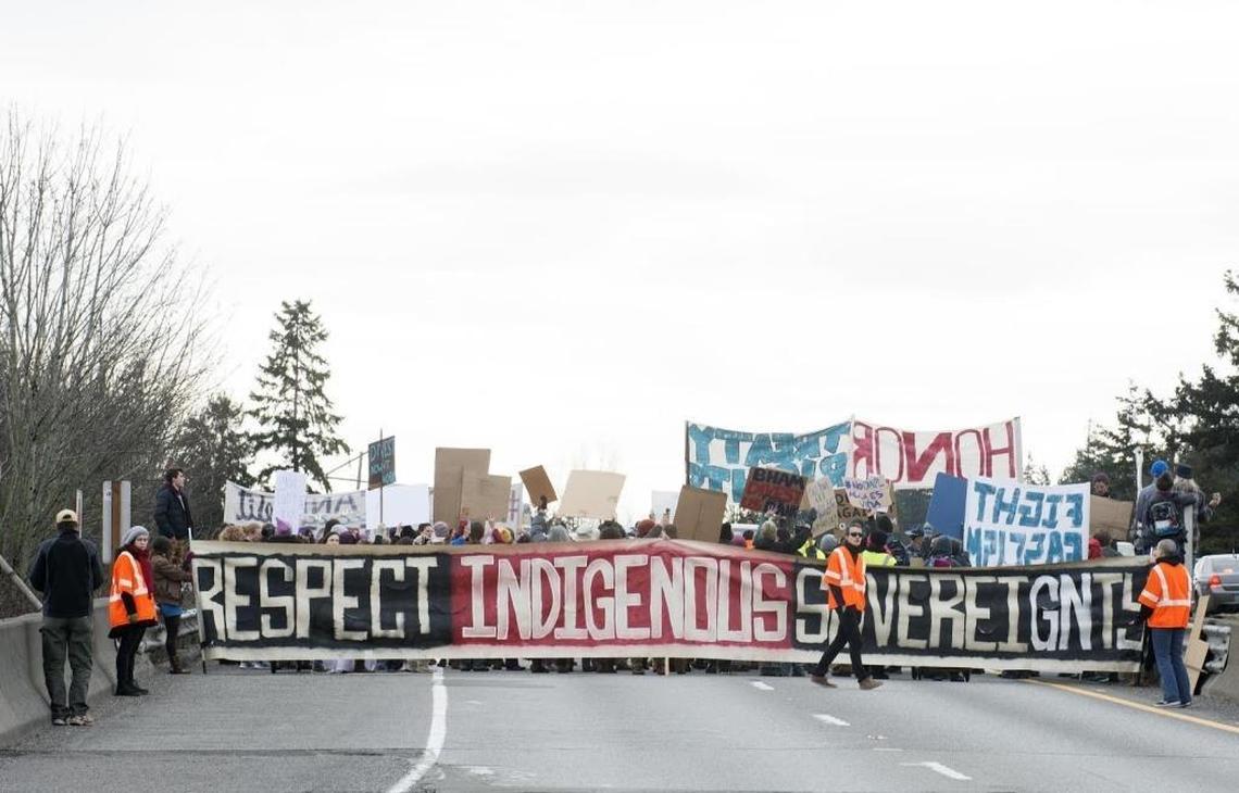 Protesters block northbound Interstate Five at Lakeway Drive in protest of the Dakota Access Pipeline on Saturday, Feb. 11, 2017, in Bellingham. In preparation for May Day, state patrol officials in King County are referencing the Bellingham protest to warn demonstrators against blocking freeways.