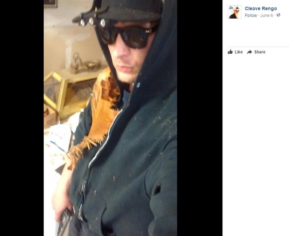 A screenshot of a post on the Facebook page of Cleve Allen Goheen-Rengo, 26, aka Cleave Rengo. A blurry object in the bottom left corner appears to be a handgun, according to charging papers. Prosecutors allege he was making a death threat to a Whatcom County judge.