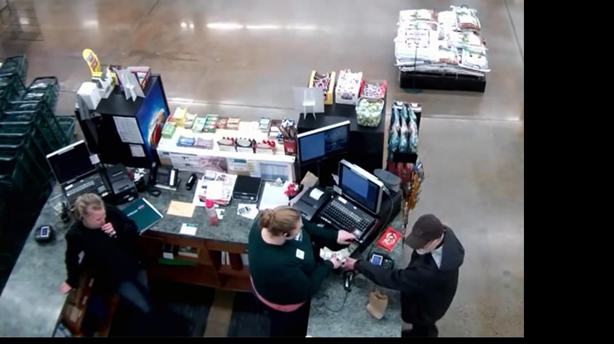 
This screen grab from a security camera shows a man taking cash from the WFC Fairhaven store on Jan. 19. Bellingham police have evidence linking Dennis Jeffrey Ridley, 63, to the robbery; Ridley was arrested in California in April and extradited to Skagit County on Tuesday, June 9. He is being held on suspicion of robbing Lafeen's Donuts in Burlington.

