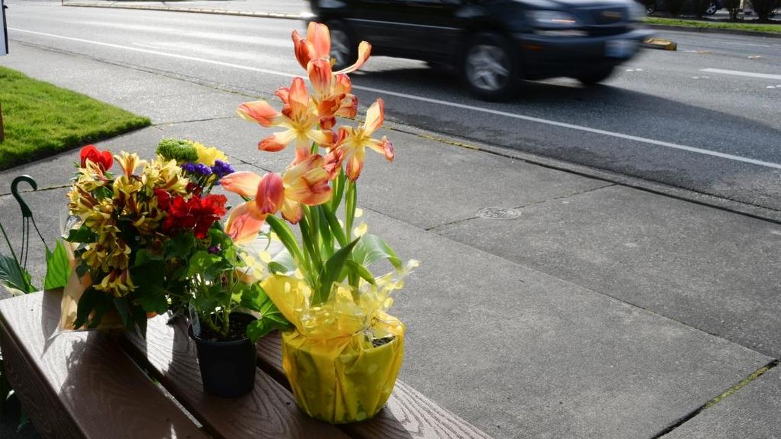Flowers are placed on a bench near the intersection of Old Fairhaven Parkway Thursday morning, March 23, 2017, for bicyclist Eric Michael Weight, who died after colliding with a pickup truck Wednesday morning.