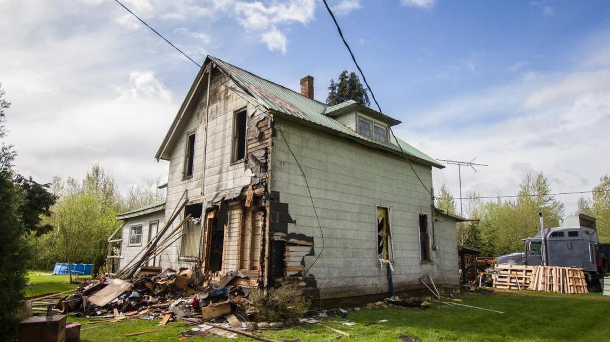 The house at 1890 Nolte Road in Everson is heavily damaged Monday morning, April 4, after a Sunday fire. Randy Velthuizen, the home’s occupant, was using a blowtorch to get rid of weeds in a flowerbed shortly before the fire started.