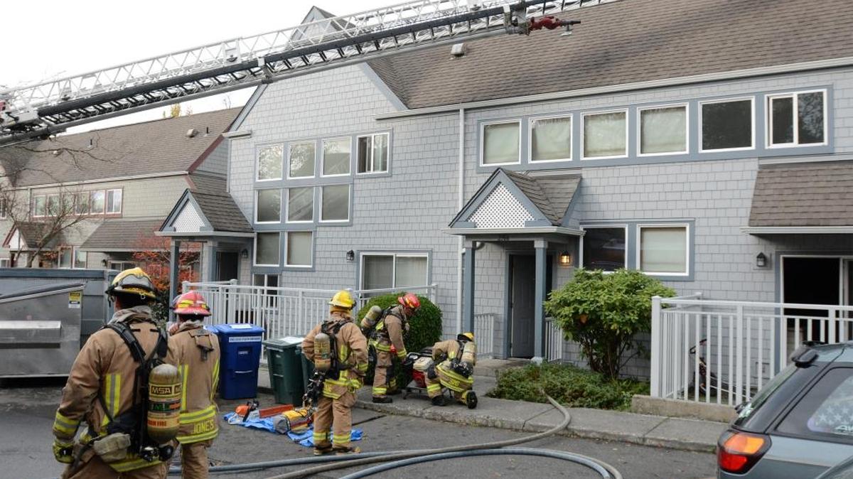 Bellingham firefighters respond to a fire Monday Nov. 2, 2015, at Hillside Homes, near the 2100 block of Yew Street in Bellingham. No one was injured. The cause of the fire was under investigation Monday by the city fire marshal.