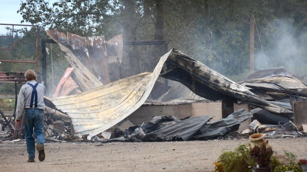 
The remains of a building destroyed by fire at the home of Todd and Paula Crabtree and Crabtree Wild Game Processing Monday, Sept. 14, 2015.
