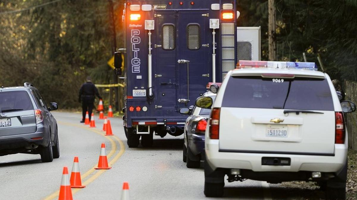 Bellingham Police investigate the scene at 5765 Mosquito Lake Road east of Deming, Nov. 17, 2014, after the Whatcom County Sheriff's SWAT team got into a shootout with Cecil Chaney Tinker-Smith. It ended with the man dead and one SWAT member wounded.