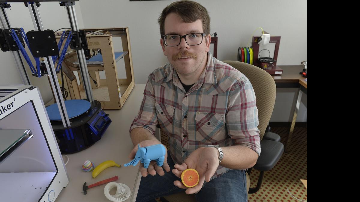 
Co-owner Troy Greig shows some items made from 3-D printers at The Foundary, at 1515 North State Street in Bellingham on Sept. 11, 2015. The new community workshop lets members learn to use both traditional and new technology to make things.
