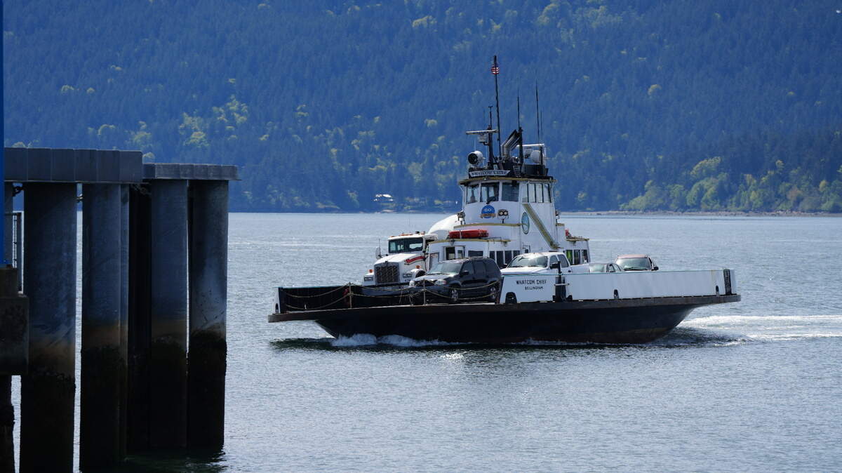 The Lummi Island ferry, the Whatcom Chief, arrives to the Lummi Nation mainland in 2024, to unload vehicles and take on new passengers.