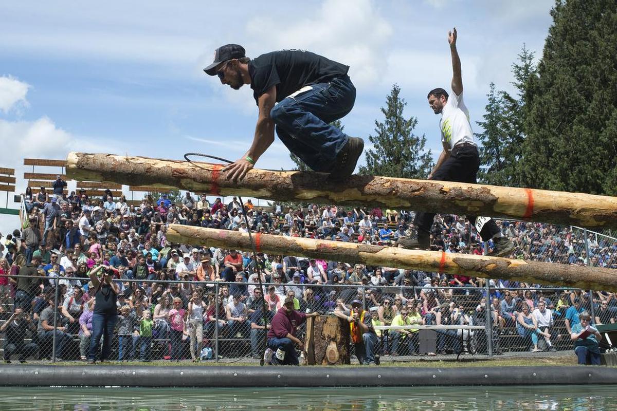 Andrew Moore, left, and Nick Van Brocklin compete in the obstacle choker setting event at the 2017 Deming Logging Show.