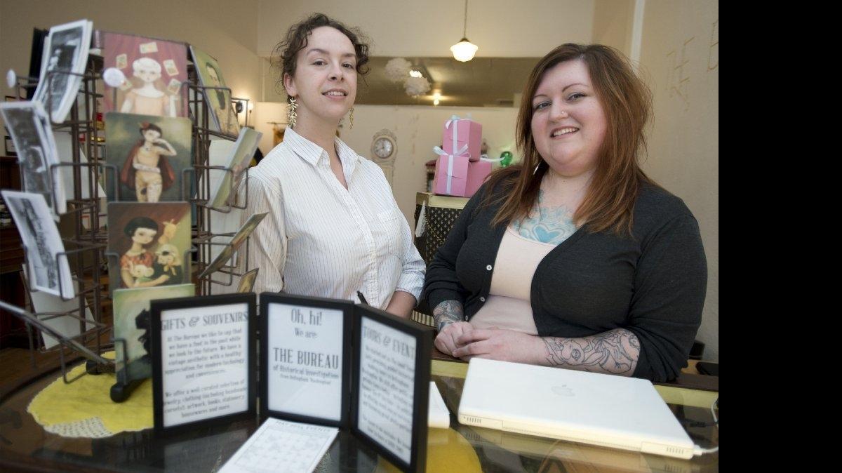
Founders of the Bureau of Historical Investigation, Marris McGrath, left, and Sara Holodnick, right, also known as The Good Time Girls, at their storefront at 217 W. Holly St. The Bureau will be hosting free history tours of downtown Bellingham on Saturdays from July 11 through Sept. 26.
