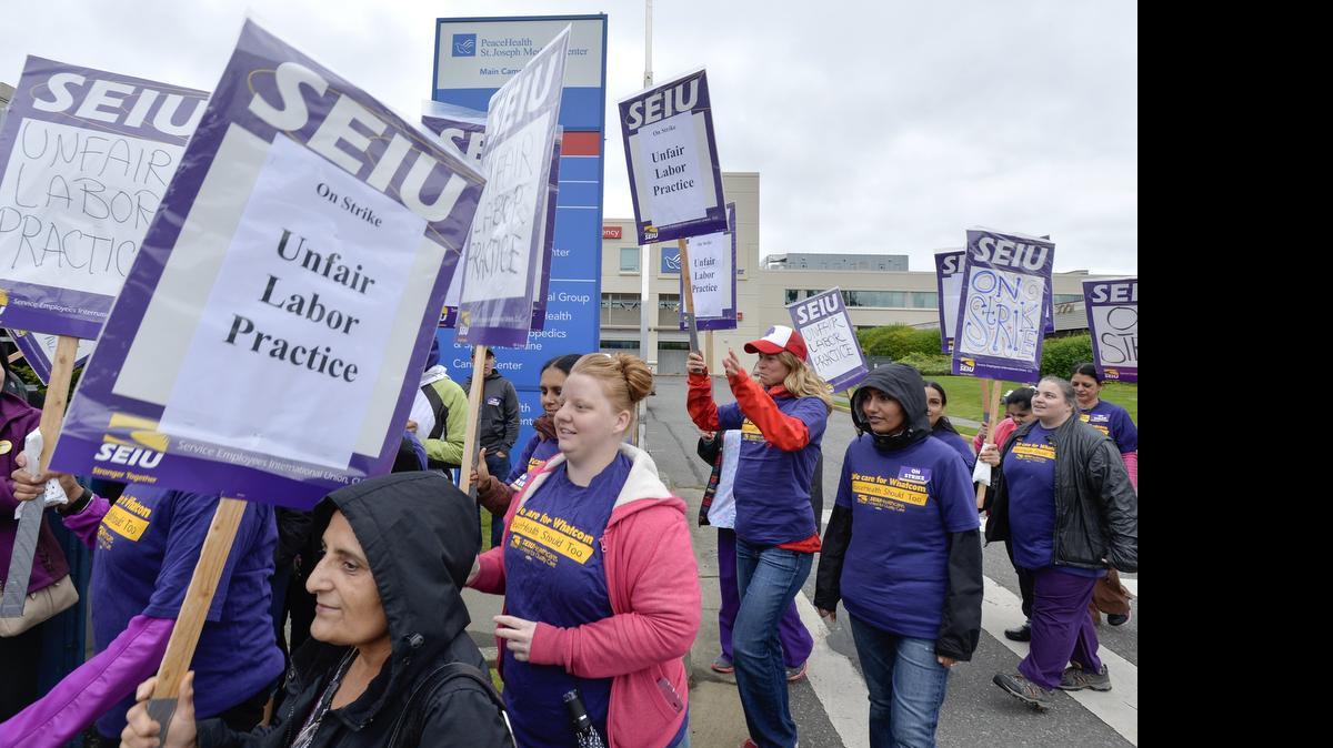 
SEIU union healthcare workers picket outside PeaceHealth St. Joseph Medical Center in Bellingham during a one day strike May 13, 2015. The workers and PeaceHealth have agreed on a contract that will increase wages and gives workers a signing bonus.
