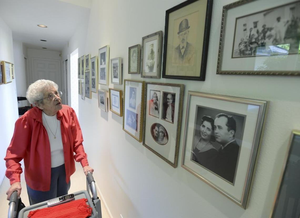In May 2016, Holocaust survivor Noemi Ban, then 93, looked at photos of her family at her Bellingham home. Several of her family members were killed at the Auschwitz death camp in World War II.