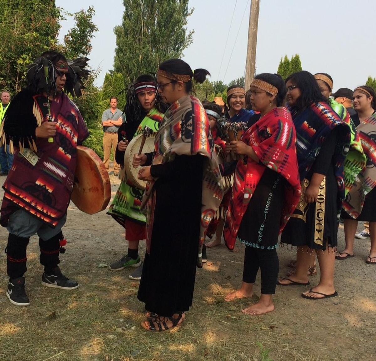 The Lummi Nation Blackhawk singers get ready to begin a blessing ceremony for the groundbreaking of its first phase of Salish Village on Tuesday, Aug. 1.
