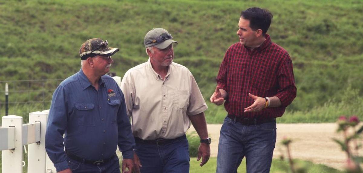 Presidential candidate Scott Walker, right, said building a wall to secure the border between the U.S. and Canada is an idea worth considering. 